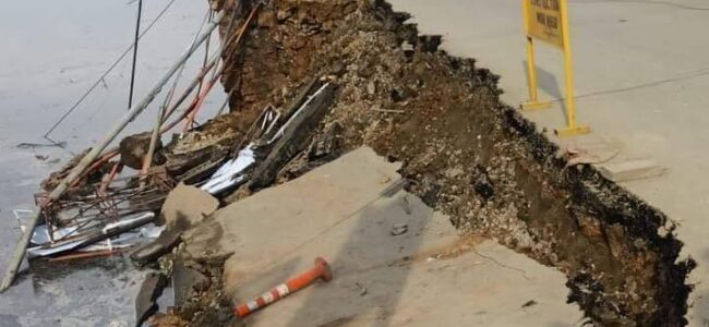 Two-wheeler, Shikaras damaged after road caves in at Dalgate Two-wheeler, Shikaras damaged after road caves in at Dalgate