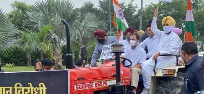 Rahul Gandhi drives tractor to Parliament to protest against farm laws Rahul Gandhi drives tractor to Parliament to protest against farm laws